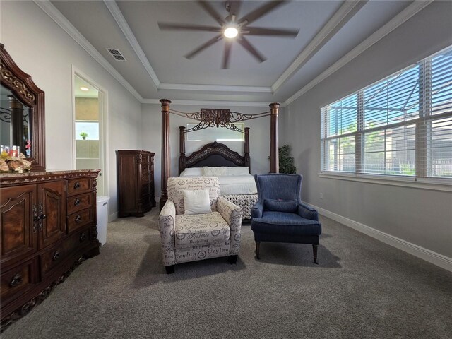 2853 Willowseed Ln, Saint Cloud, FL 34772 - bedroom with a raised ceiling, light carpet, crown molding, a ceiling fan, and ensuite bathroom