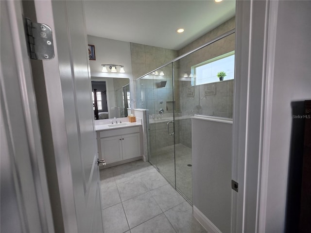 2853 Willowseed Ln, Saint Cloud, FL 34772 - full bath featuring vanity, a shower stall, and tile patterned floors