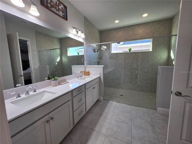 2853 Willowseed Ln, Saint Cloud, FL 34772 - full bath featuring a shower stall, double vanity, and tile patterned floors