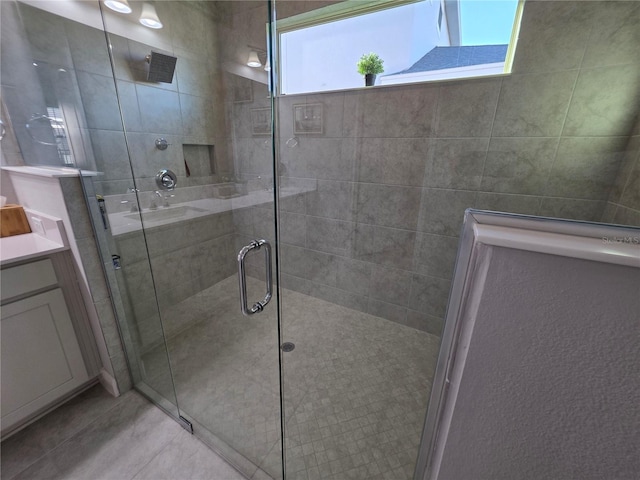 2853 Willowseed Ln, Saint Cloud, FL 34772 - full bathroom featuring a shower stall, vanity, and tile patterned floors