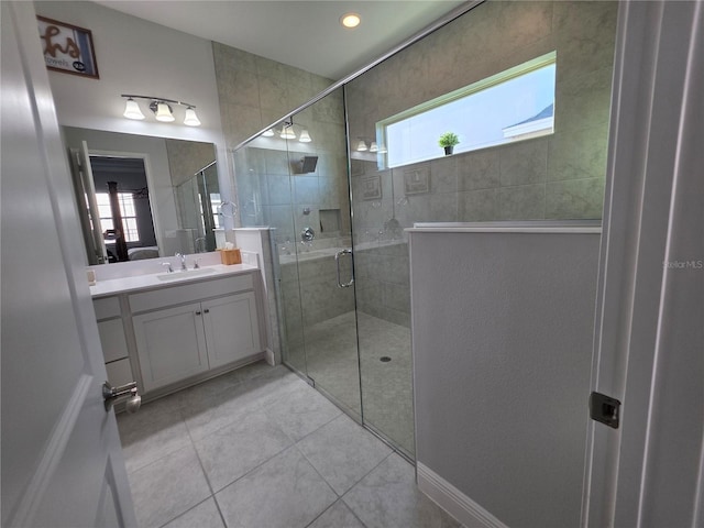 2853 Willowseed Ln, Saint Cloud, FL 34772 - bathroom with vanity, a shower stall, tile patterned floors, and recessed lighting
