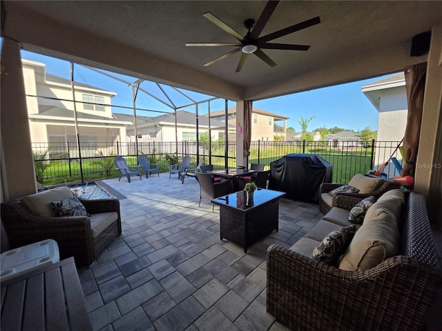 2853 Willowseed Ln, Saint Cloud, FL 34772 - view of patio with an outdoor hangout area, a ceiling fan, area for grilling, glass enclosure, and a residential view