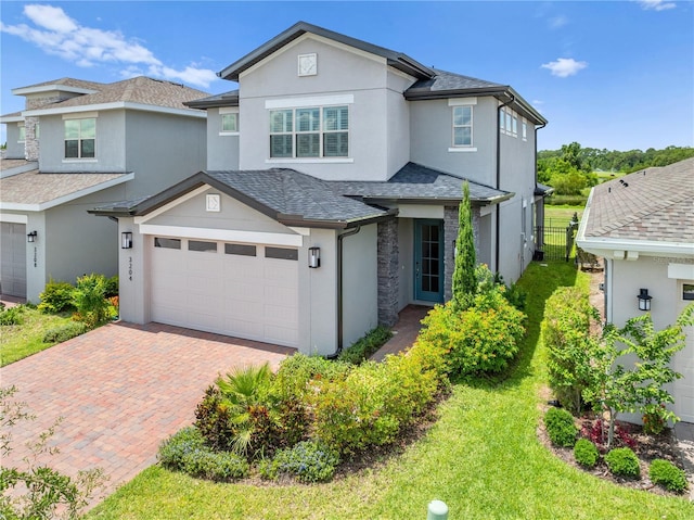 3204 Oxbow Ct, Saint Cloud, FL 34773 - traditional home featuring stucco siding, decorative driveway, and a shingled roof