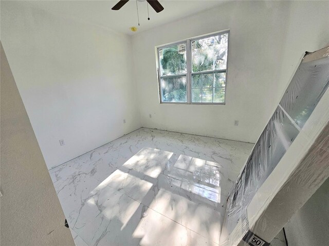 1236 N Virginia Ave, Lakeland, FL 33805 - unfurnished room featuring marble finish flooring and a ceiling fan
