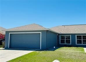 851 Adour Dr Unit A-B, Kissimmee, FL 34759 - single story home featuring a garage, concrete driveway, and a front lawn