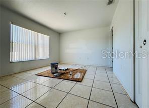 851 Adour Dr Unit A-B, Kissimmee, FL 34759 - view of tiled spare room