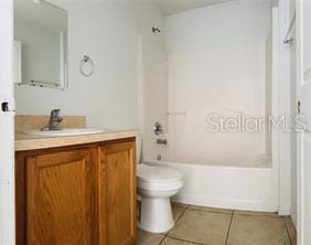 851 Adour Dr Unit A-B, Kissimmee, FL 34759 - bathroom with vanity, tile patterned flooring, and shower / tub combination