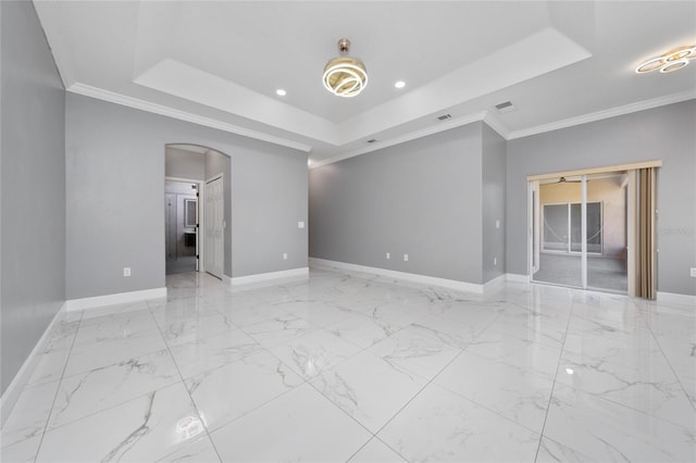 1950 Windward Oaks Ct, Kissimmee, FL 34746 - unfurnished room with a tray ceiling, arched walkways, recessed lighting, crown molding, and marble finish flooring