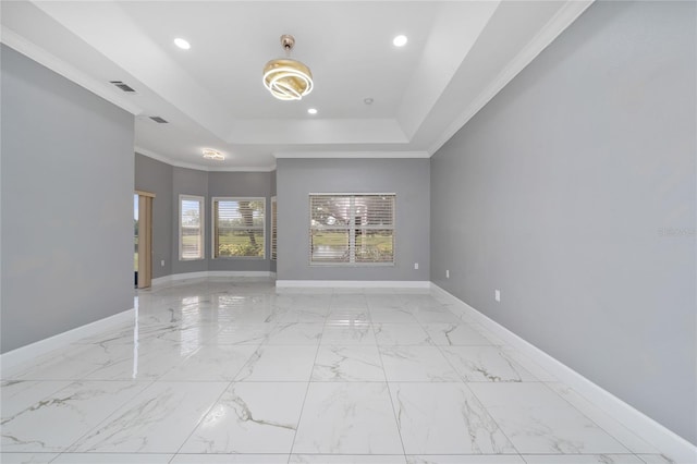 1950 Windward Oaks Ct, Kissimmee, FL 34746 - spare room with a tray ceiling, ornamental molding, recessed lighting, and light marble finish flooring