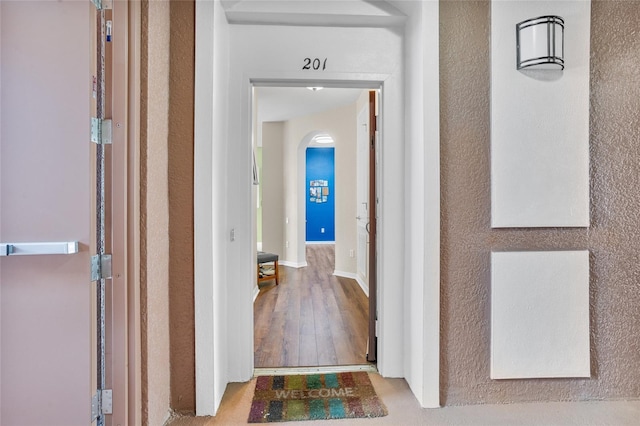 1351 Venezia Ct Unit 201, Davenport, FL 33896 - corridor with arched walkways and wood finished floors