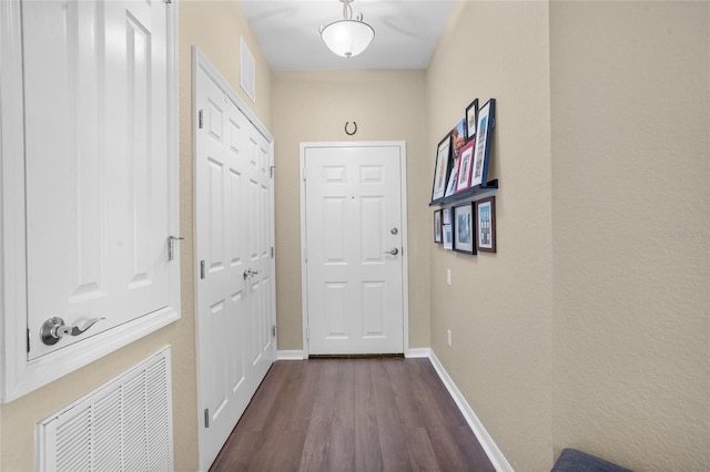 1351 Venezia Ct Unit 201, Davenport, FL 33896 - doorway to outside featuring dark wood-style floors and baseboards
