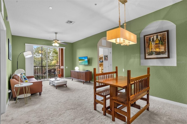 1351 Venezia Ct Unit 201, Davenport, FL 33896 - dining area with arched walkways, carpet, and ceiling fan