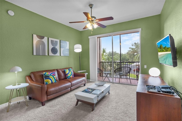 1351 Venezia Ct Unit 201, Davenport, FL 33896 - living room featuring carpet floors, ceiling fan, and a textured wall