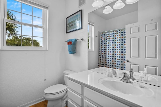 1351 Venezia Ct Unit 201, Davenport, FL 33896 - bathroom featuring vanity, wood finished floors, and a shower with shower curtain