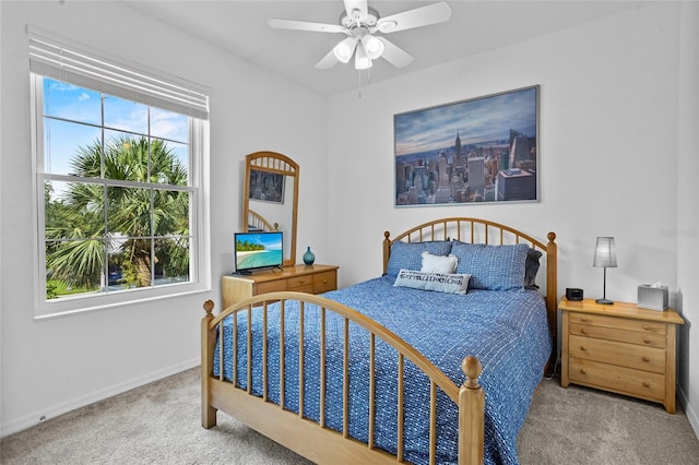 1351 Venezia Ct Unit 201, Davenport, FL 33896 - carpeted bedroom featuring baseboards and a ceiling fan
