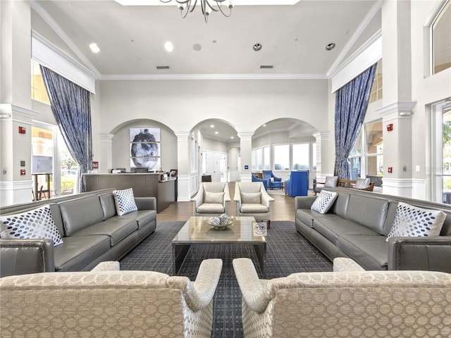 1351 Venezia Ct Unit 201, Davenport, FL 33896 - community lobby featuring high vaulted ceiling, ornamental molding, and a wainscoted wall