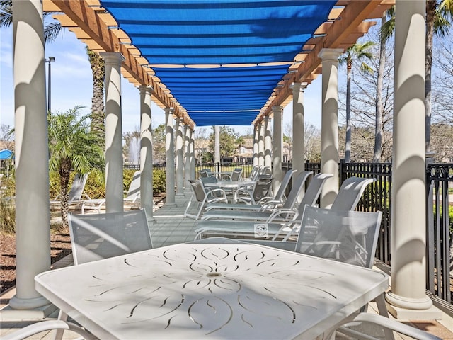 1351 Venezia Ct Unit 201, Davenport, FL 33896 - view of patio / terrace featuring outdoor dining space and a pergola