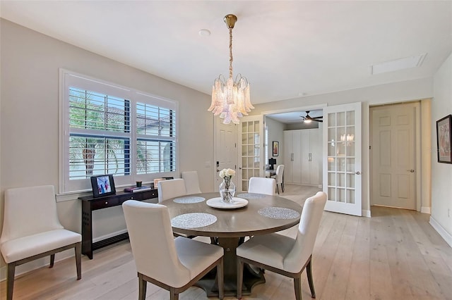 17109 Kenton Ter, Bradenton, FL 34202 - dining area featuring light wood-style flooring, a chandelier, and ceiling fan