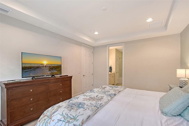 17109 Kenton Ter, Bradenton, FL 34202 - bedroom featuring a tray ceiling, recessed lighting, and ensuite bathroom