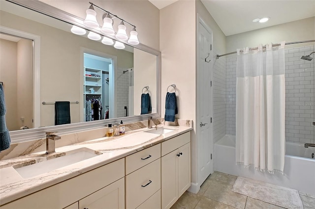 17109 Kenton Ter, Bradenton, FL 34202 - bathroom with shower / tub combo, double vanity, a spacious closet, and tile patterned floors
