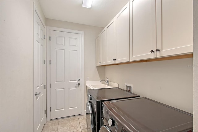 17109 Kenton Ter, Bradenton, FL 34202 - laundry area with cabinet space, washing machine and clothes dryer, and light tile patterned floors