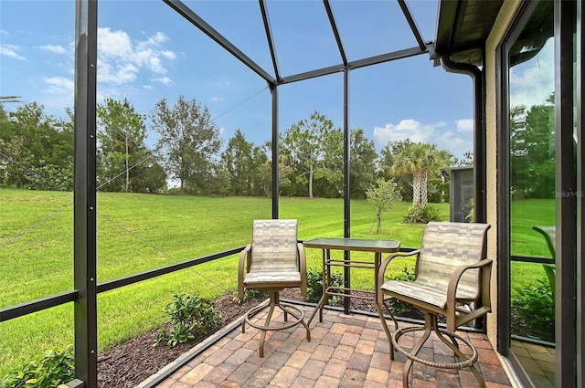 17109 Kenton Ter, Bradenton, FL 34202 - sunroom / solarium featuring view of wooded area