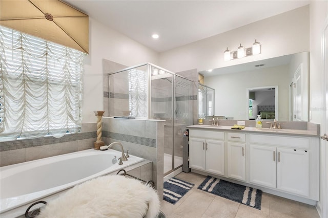 1452 Mickelson Ct, Davenport, FL 33896 - full bath featuring a shower stall, a garden tub, double vanity, tile patterned floors, and recessed lighting