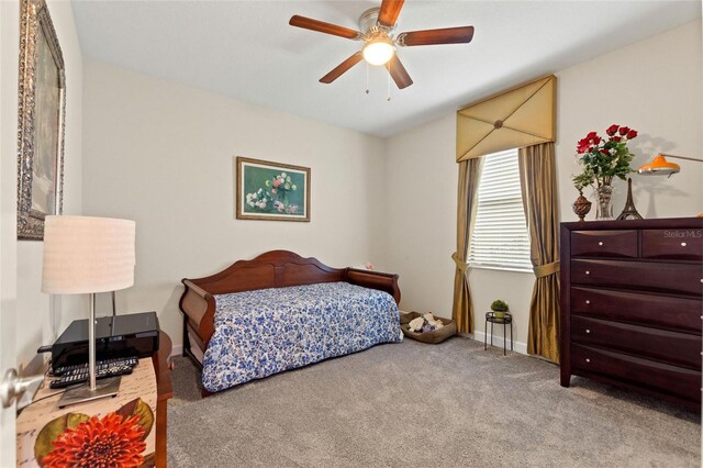 1452 Mickelson Ct, Davenport, FL 33896 - carpeted bedroom featuring baseboards and a ceiling fan