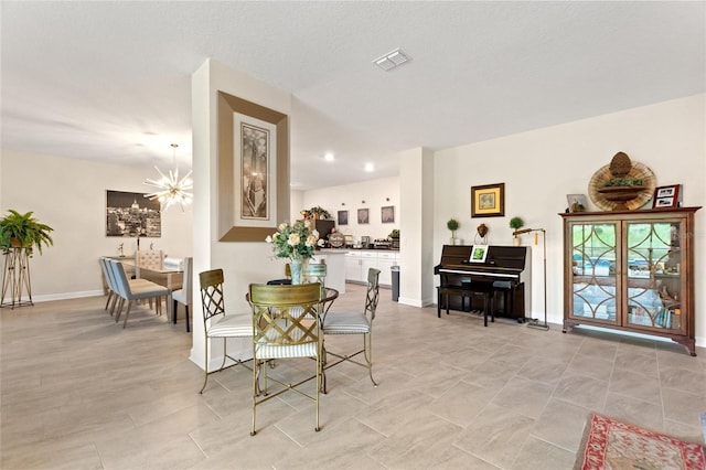 1452 Mickelson Ct, Davenport, FL 33896 - dining area featuring a chandelier and baseboards