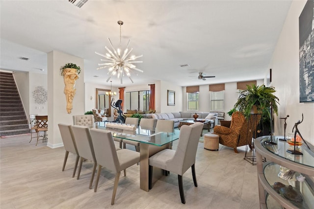 1452 Mickelson Ct, Davenport, FL 33896 - dining area with stairs, a chandelier, and ceiling fan