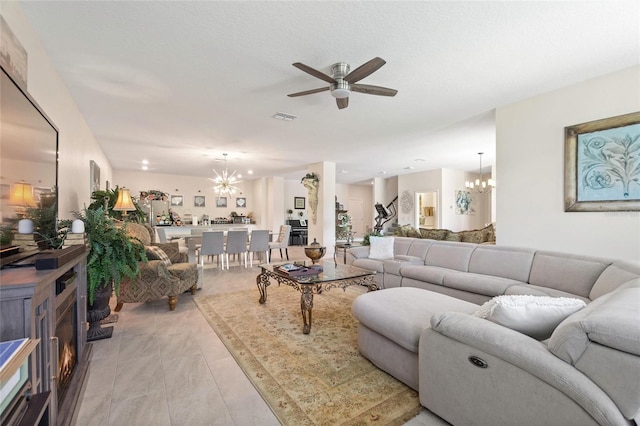 1452 Mickelson Ct, Davenport, FL 33896 - living room featuring a chandelier and ceiling fan