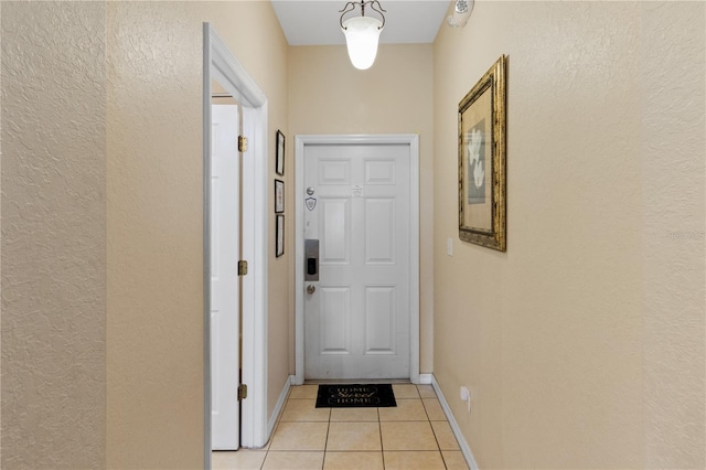 2708 Camaro Dr, Kissimmee, FL 34746 - doorway featuring light tile patterned flooring and a textured wall