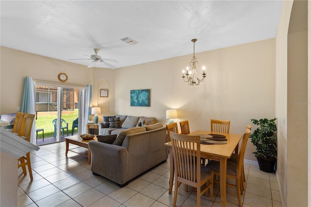 2708 Camaro Dr, Kissimmee, FL 34746 - living room featuring light tile patterned floors, a chandelier, and a ceiling fan