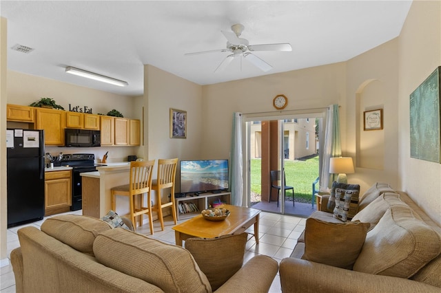 2708 Camaro Dr, Kissimmee, FL 34746 - living area featuring light tile patterned flooring and ceiling fan