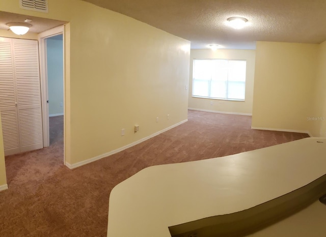 4540 Commander Dr Unit 2214, Orlando, FL 32822 - carpeted empty room with a textured ceiling and baseboards