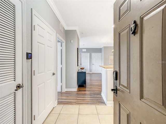 1361 Tuscan Ter Unit 7303, Davenport, FL 33896 - entryway featuring light tile patterned floors and crown molding