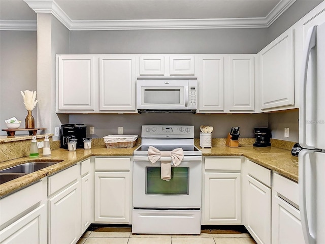 1361 Tuscan Ter Unit 7303, Davenport, FL 33896 - kitchen featuring white appliances, ornamental molding, light tile patterned floors, and white cabinetry