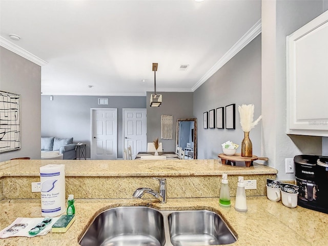 1361 Tuscan Ter Unit 7303, Davenport, FL 33896 - kitchen featuring ornamental molding, light stone countertops, open floor plan, white cabinets, and pendant lighting