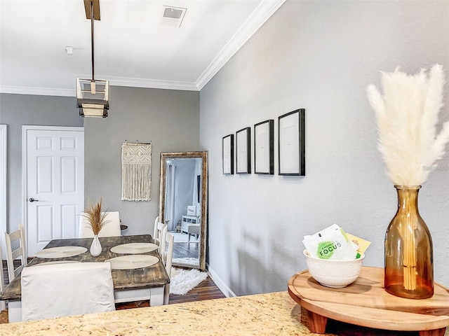 1361 Tuscan Ter Unit 7303, Davenport, FL 33896 - dining room featuring crown molding and wood finished floors