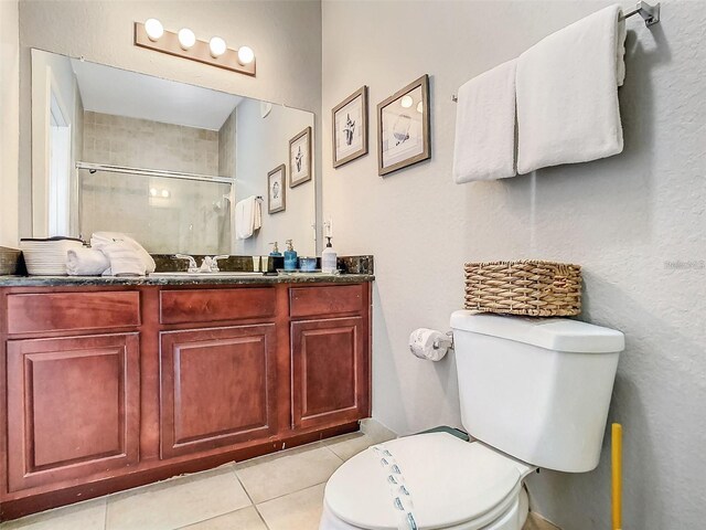 1361 Tuscan Ter Unit 7303, Davenport, FL 33896 - full bathroom featuring a shower with door, tile patterned floors, and vanity
