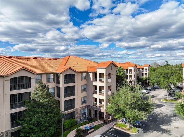 1361 Tuscan Ter Unit 7303, Davenport, FL 33896 - view of apartment building / complex featuring uncovered parking