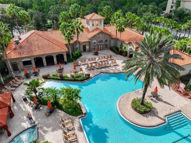 1361 Tuscan Ter Unit 7303, Davenport, FL 33896 - community pool featuring a patio