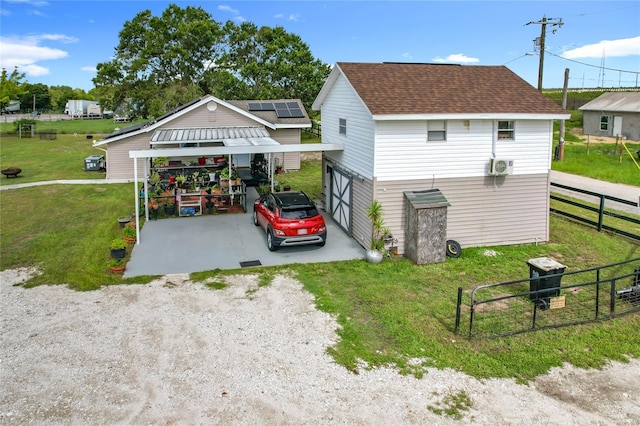 view of property exterior featuring roof with shingles and driveway