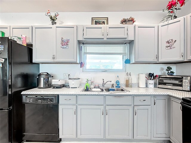 kitchen with black appliances and light countertops