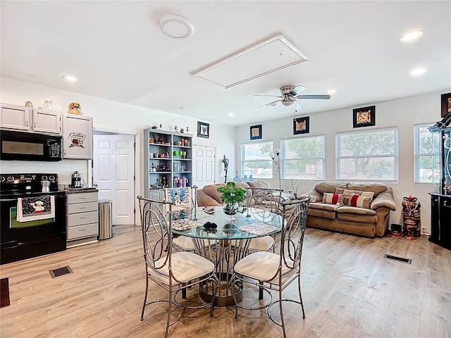 dining space featuring attic access, healthy amount of natural light, light wood finished floors, a ceiling fan, and recessed lighting