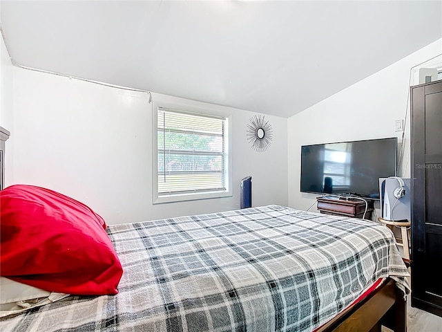 bedroom with vaulted ceiling