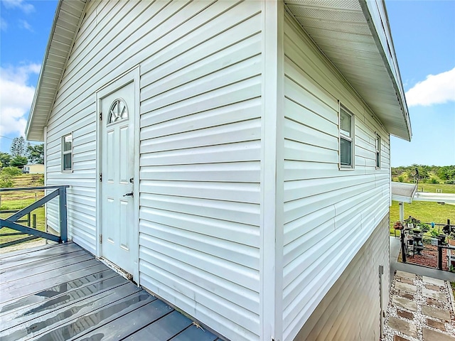 view of side of property with a wooden deck
