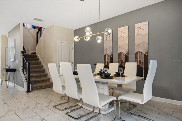 4547 Narrative Ln, Kissimmee, FL 34746 - dining space with marble finish flooring and stairs