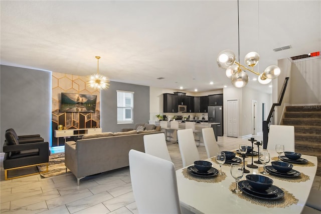 4547 Narrative Ln, Kissimmee, FL 34746 - dining space with a chandelier, stairway, light marble finish floors, and recessed lighting