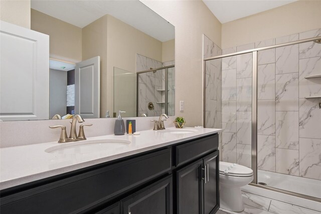 4547 Narrative Ln, Kissimmee, FL 34746 - bathroom featuring double vanity, marble look tiles, and a shower stall